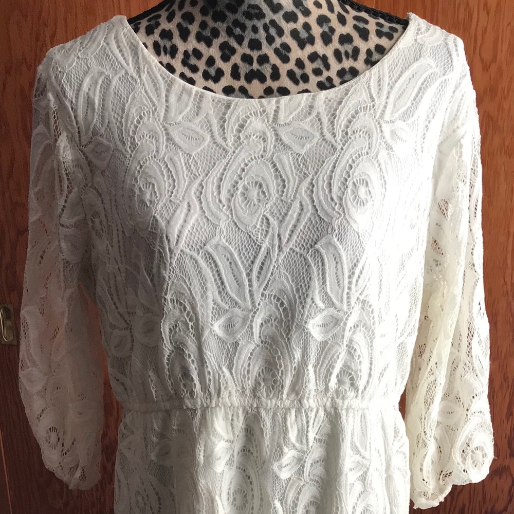 Just above knee length white lace dress